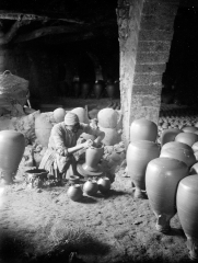 man making clay vases