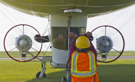 manned airship is signaled to cut engines at Lake Front Airport