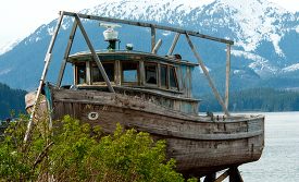 Old wooden boat along the shore Alaska