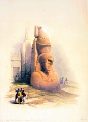 One of two colossal statues of Rameses II entrance to the Temple