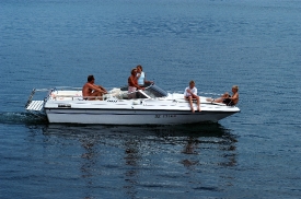 People enjoying boat on lake in Switzerland