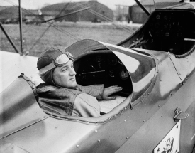 pilot sitting in cockpit of type of curtis airplane 1927