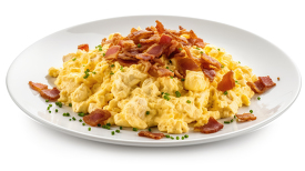 plate of fluffy scrambled eggs with pieces crispy bacon