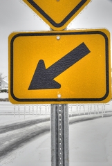 road sign covered with ice and snow