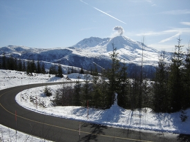 road with mount st helens volcano in background