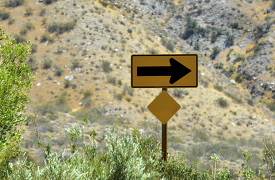 roadway arrow sign in the california desert
