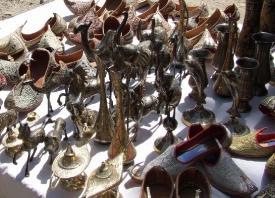 Shoes sculptures and goblets for sale at a Kabul bazaar Afghanis