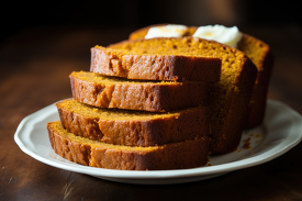 slices hearty pumpkin bread generously topped with butter
