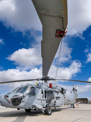 standing under blade of navy helicopter at airshow-548A