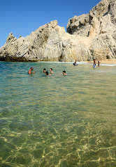 swimming at beach in cabo san lucas mexico