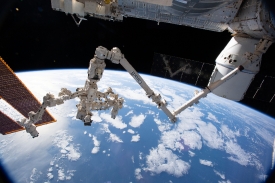 the canadarm2 robotic arm with its robotic hand also known as de