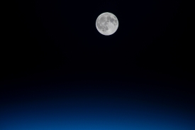 the full moon above the atlantic ocean