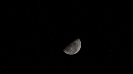 the last quarter moon pictured from the international space stat
