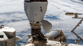 the spacex cargo dragon cargo craft is pictured docked to the sp