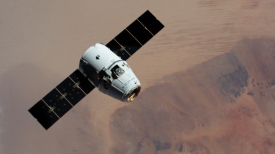 the spacex dragon cargo craft approaches the international space