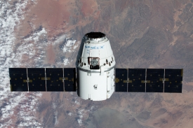 the spacex dragon cargo craft approaches the space station