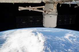 the spacex dragon cargo craft is attached to the space station 1