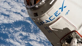 the spacex dragon cargo craft is in the grips of the canadarm2