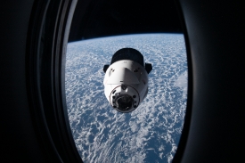 the spacex dragon cargo craft resupply ship approaches the space