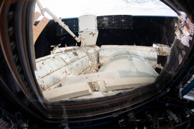 the spacex dragon cargo craft resupply ship is pictured attached