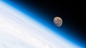the waning gibbous moon above the earths horizon 22