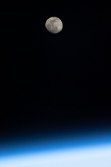 the waxing gibbous moon above earths horizon