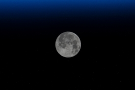 the waxing gibbous moon is pictured from the space station 11