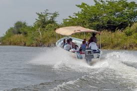 Tourist power boat on river in Belize