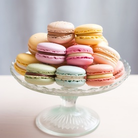 tower of assorted macarons on a glass stand