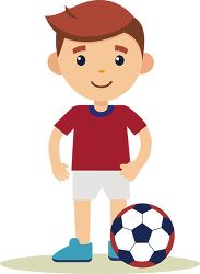 standing boy in a red shirt smiling with a soccer ball