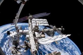 camera points downward toward the International Space Station wi