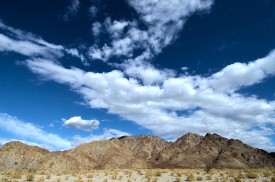 Photograph of Mountains white puffy clouds palm Springs Californ