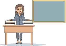 teacher in classroom with stack books on desk