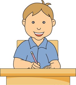 young boy at desk writing