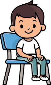 young boy sits on a chair at school