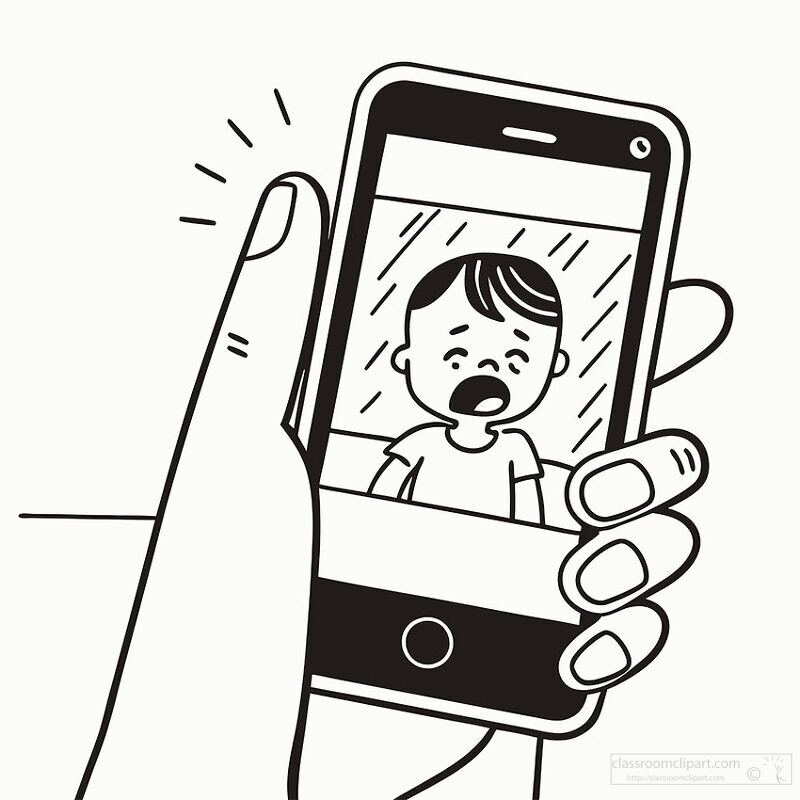 hand holding a phone displaying a notification with a crying child.