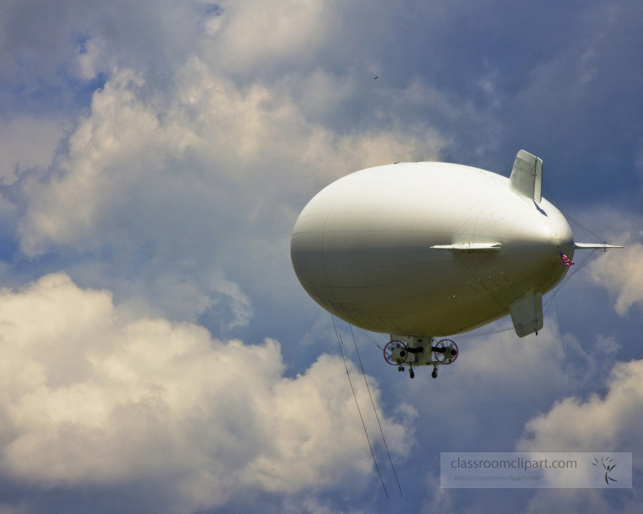  U S Navy MZ 3A manned airship flying in the puffy white clouds
