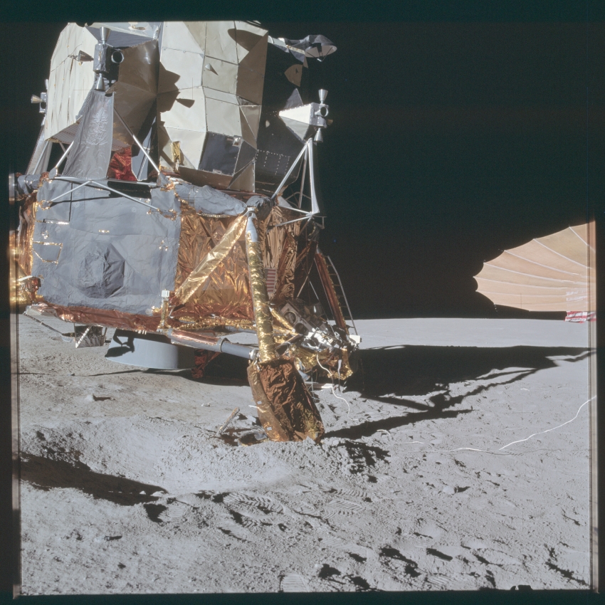 apollo 14-right side of the lunar module with footpad buried in 