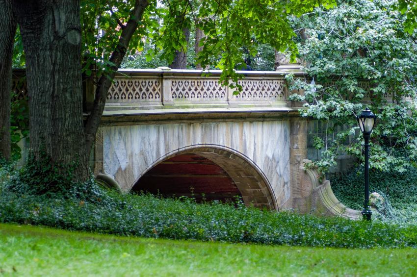 arched stone bridge covered with ivy new york