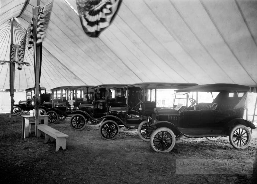 Automobiles on display in tent 1921