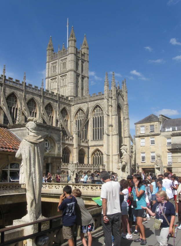 Bath Abbey stands nearby the Roman Baths in Bath England.