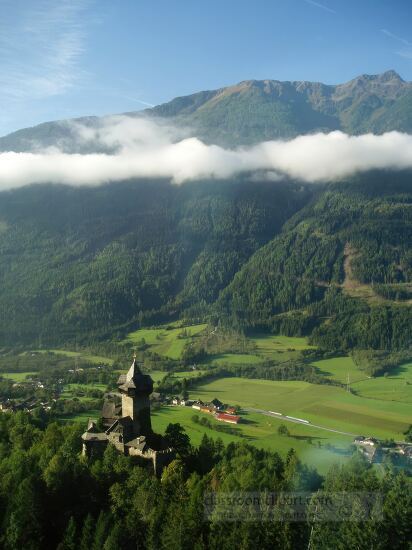 castle and mountain valley in the Alps