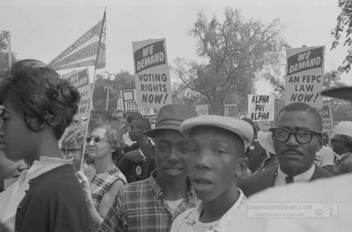 Demonstrators holding signs