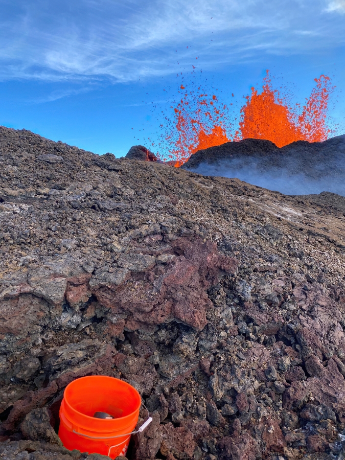 geologists deploy buckets for lava samples