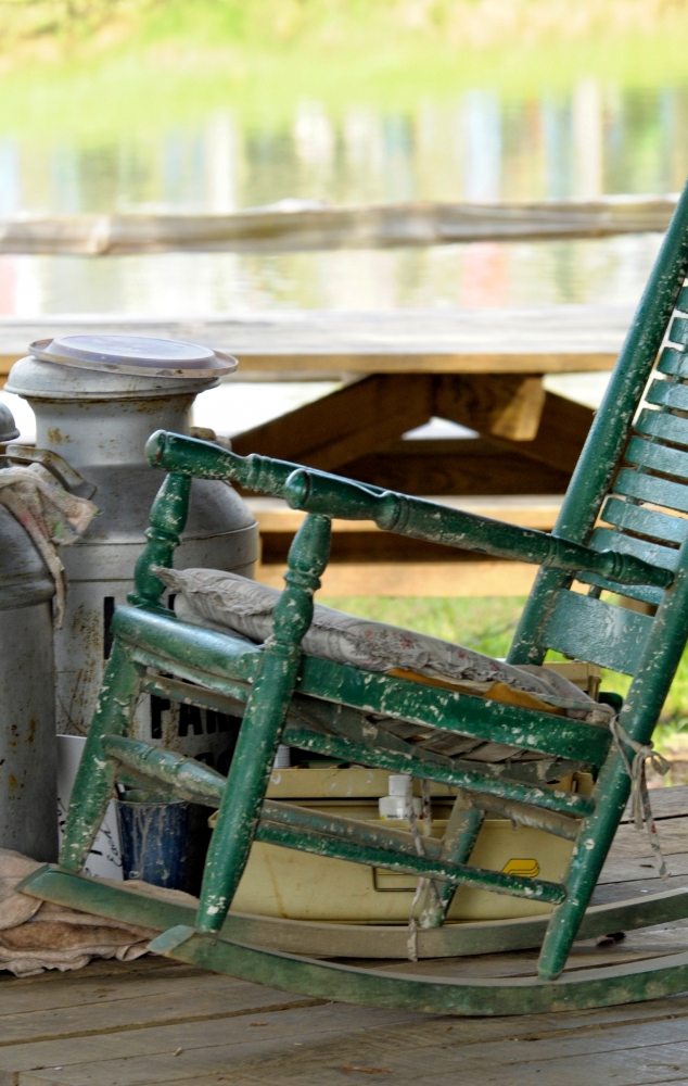 green rocking chair on porch