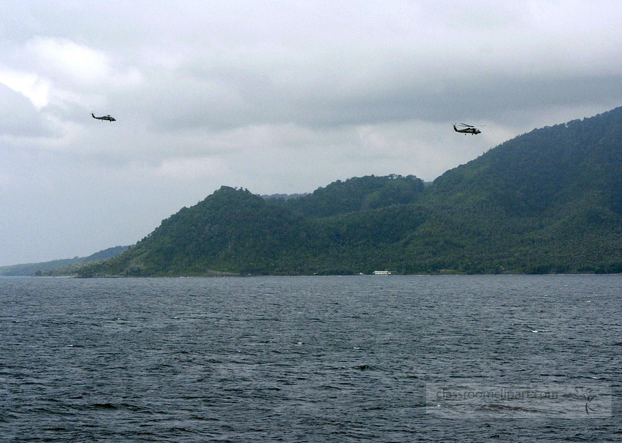 Helicopters depart from USS Abraham Lincoln