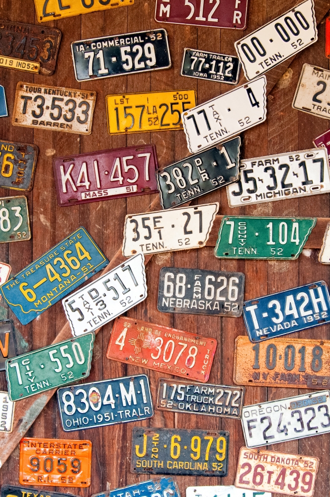 old car license plates nailed on wall