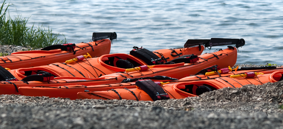 orange kayaks on shore alaska 283b