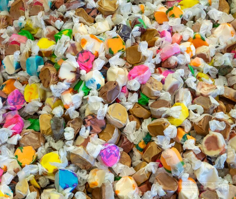 pile of colorful wrapped candies with various designs