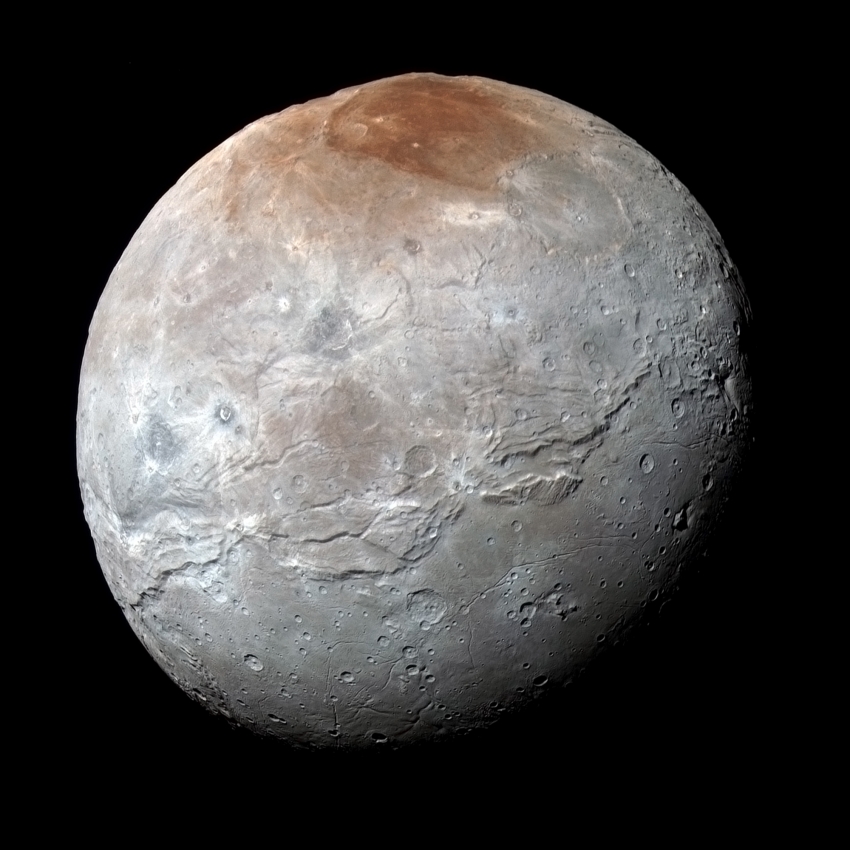 reddish polar region on Pluto largest moon,Charon